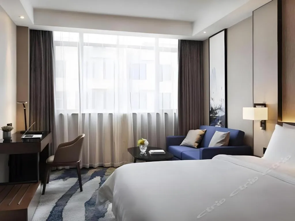 Bed in Zhonghao Boutique Hotel Dalang Business Center