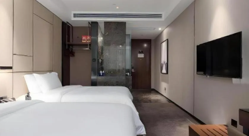 Bed in Zhonghao Boutique Hotel Dalang Business Center