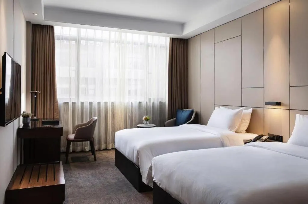 Bed in Zhonghao Boutique Hotel Dalang Business Center