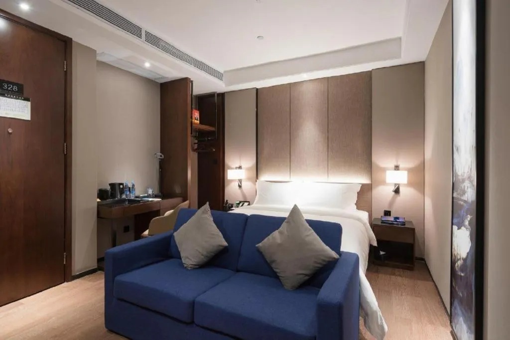 Bed in Zhonghao Boutique Hotel Dalang Business Center