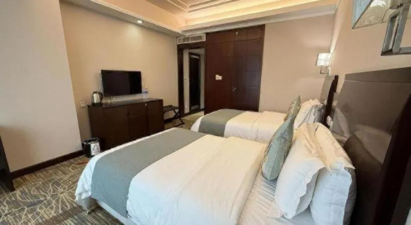 Bed in New Century Pujiang Hotel
