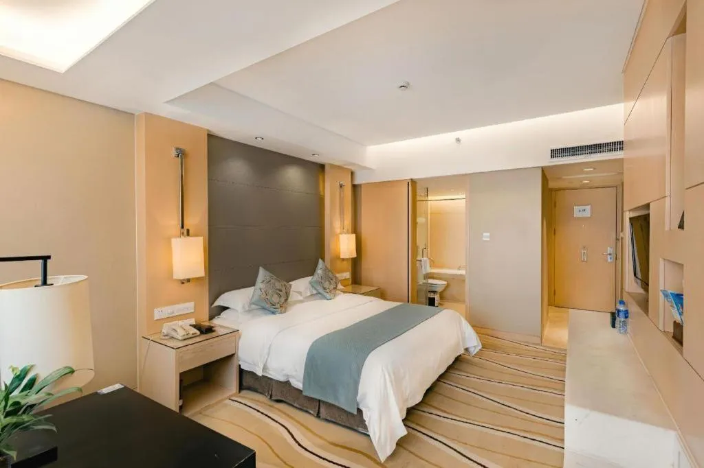 Bed in New Century Pujiang Hotel