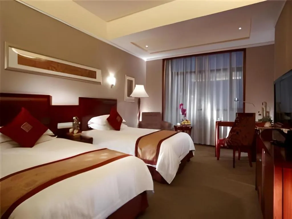 Bed in New Century Pujiang Hotel