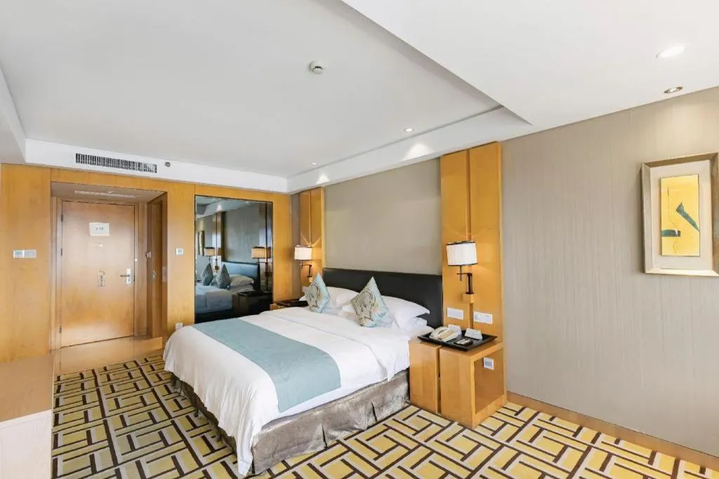 Bed in New Century Pujiang Hotel