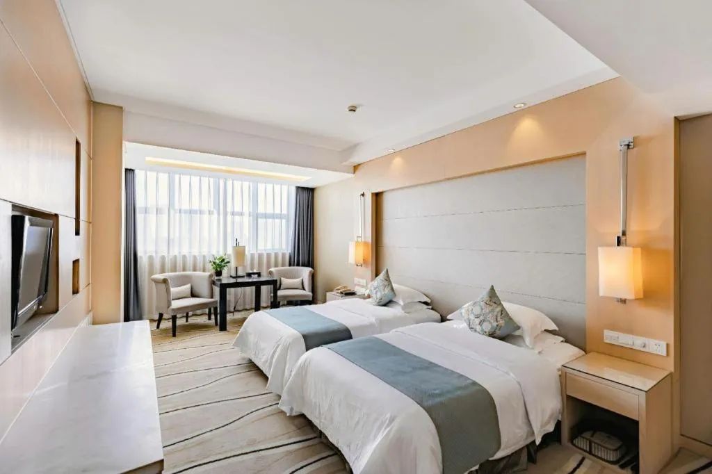 Bed in New Century Pujiang Hotel