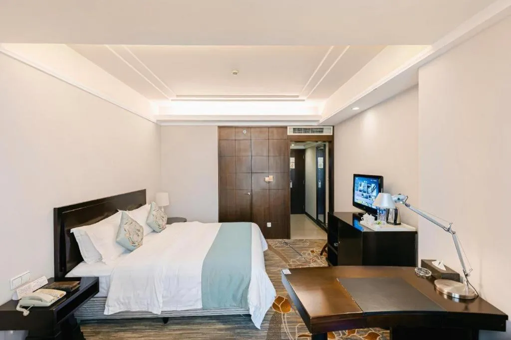 Bed in New Century Pujiang Hotel