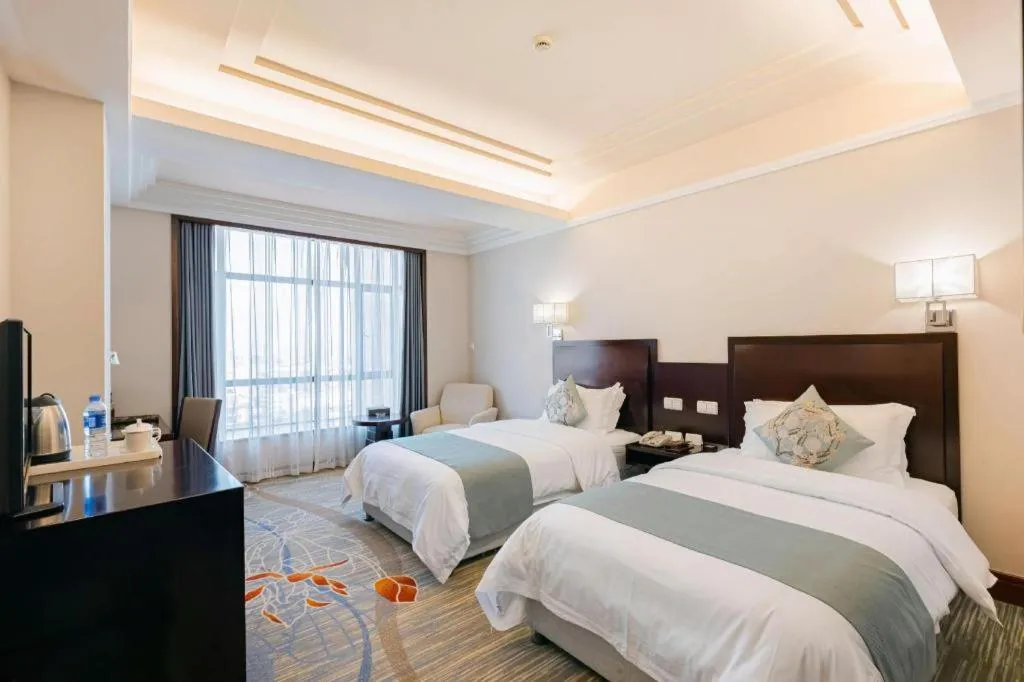 Bed in New Century Pujiang Hotel