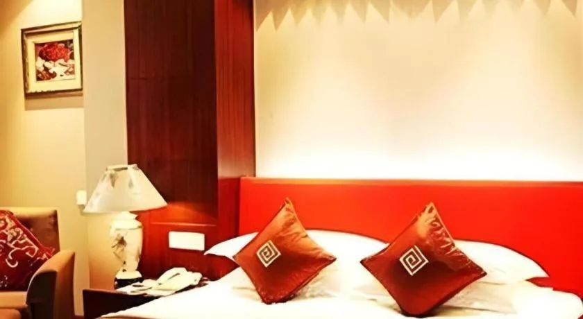 Bed in New Century Pujiang Hotel