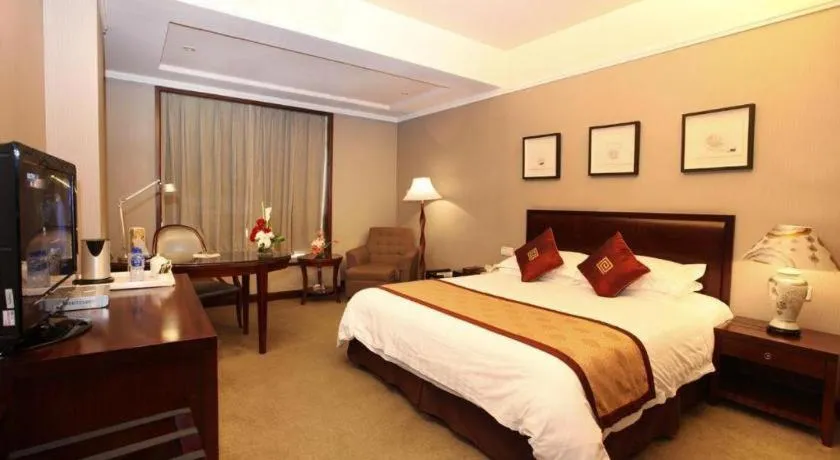 Bed in New Century Pujiang Hotel