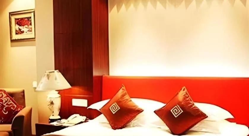Bed in New Century Pujiang Hotel