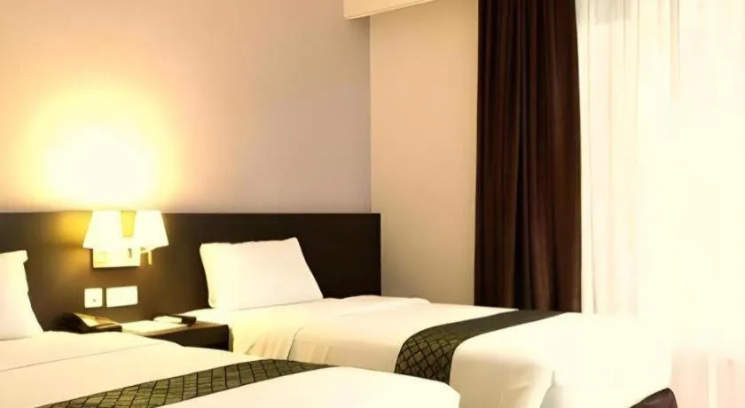 Bed in Grand Hawaii Hotel Pekanbaru