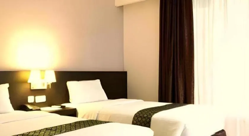 Bed in Grand Hawaii Hotel Pekanbaru