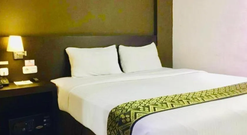 Bed in Grand Hawaii Hotel Pekanbaru