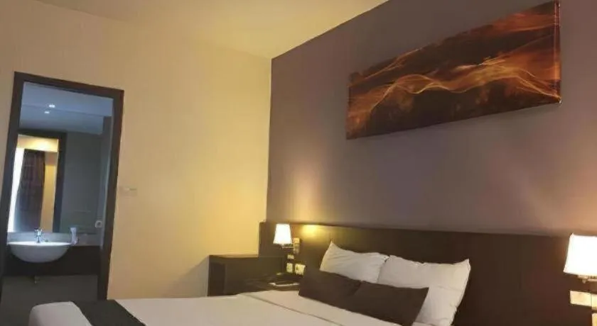 Bed in Grand Hawaii Hotel Pekanbaru