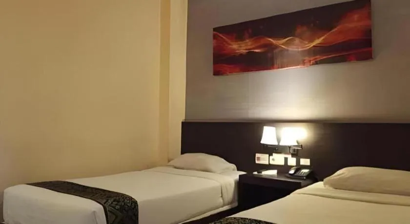 Bed in Grand Hawaii Hotel Pekanbaru