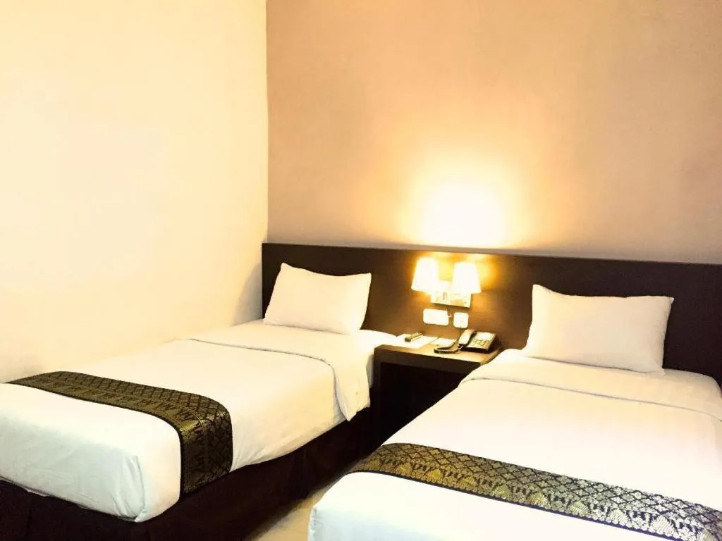 Bed in Grand Hawaii Hotel Pekanbaru