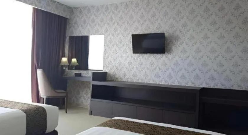 Bed in Grand Hawaii Hotel Pekanbaru