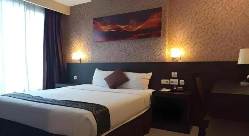 Bed in Grand Hawaii Hotel Pekanbaru