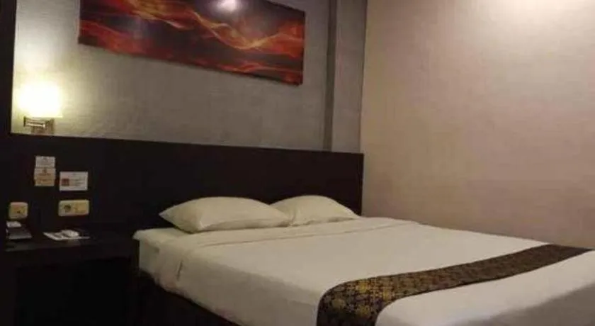 Bed in Grand Hawaii Hotel Pekanbaru