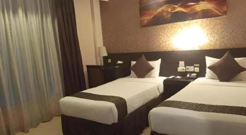 Bed in Grand Hawaii Hotel Pekanbaru