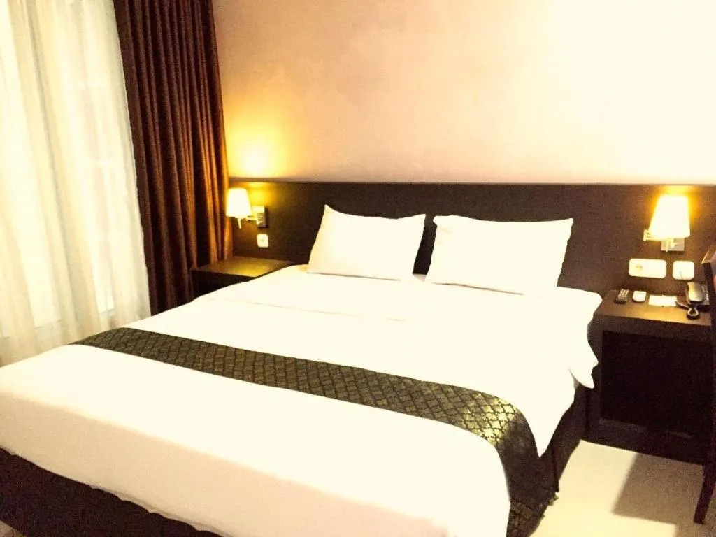 Bed in Grand Hawaii Hotel Pekanbaru