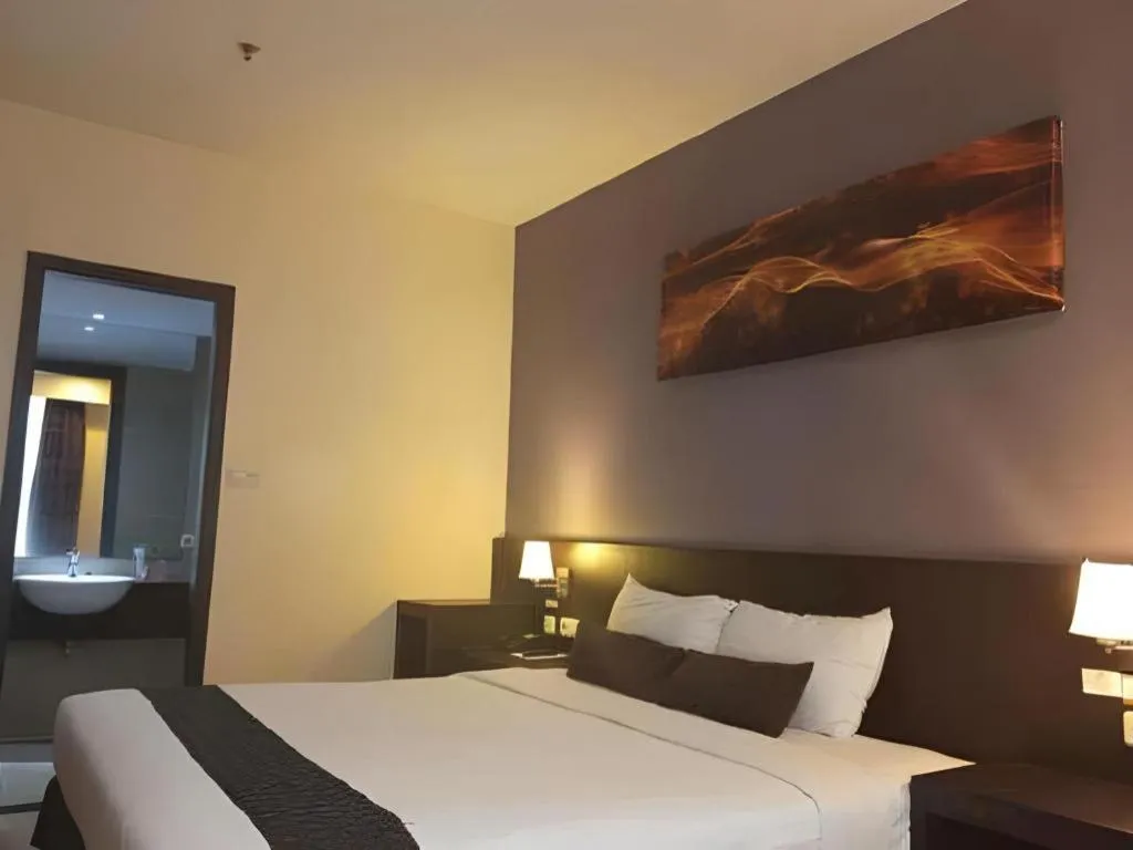 Bed in Grand Hawaii Hotel Pekanbaru