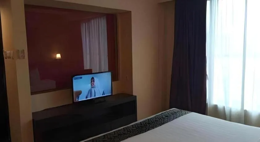 Bed in Grand Hawaii Hotel Pekanbaru