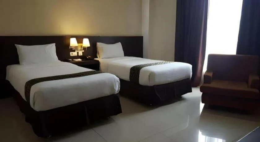 Bed in Grand Hawaii Hotel Pekanbaru