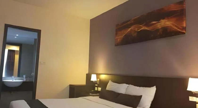 Bed in Grand Hawaii Hotel Pekanbaru