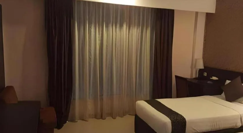 Bed in Grand Hawaii Hotel Pekanbaru