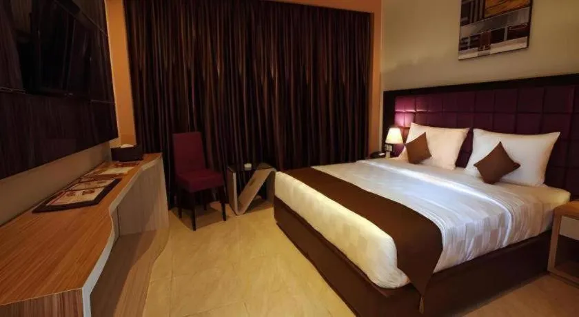 Bed in Asoka Luxury Hotel