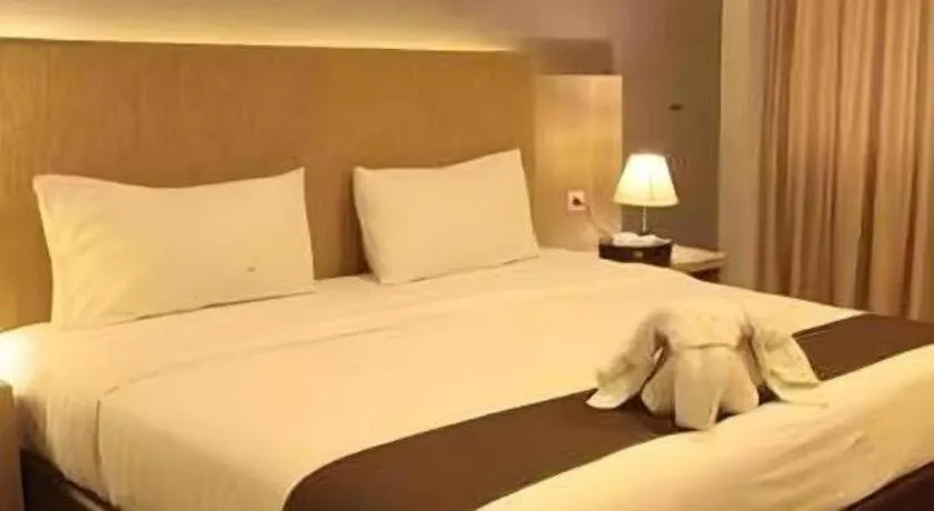 Bed in Asoka Luxury Hotel