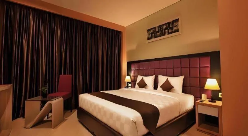 Bed in Asoka Luxury Hotel