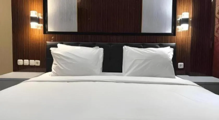 Bed in Asoka Luxury Hotel