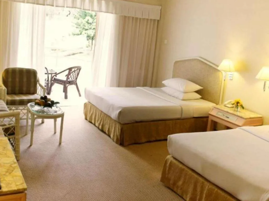 Bed in Grand Mutiara Hotel