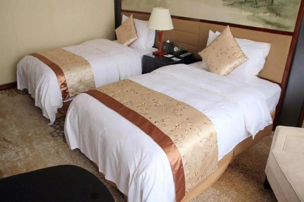 Bed in Yang Peng Jin Jiang Hotel
