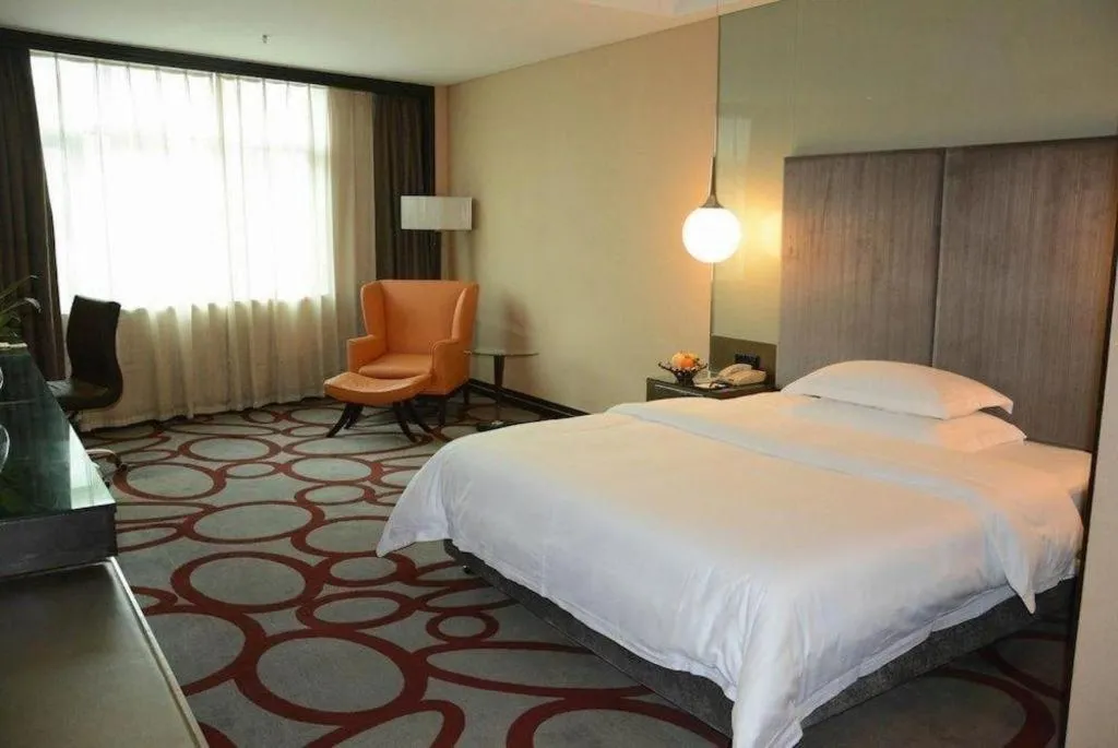 Bed in Dongguan Silver World Garden Hotel