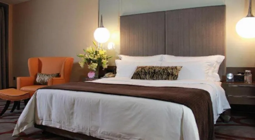 Bed in Dongguan Silver World Garden Hotel