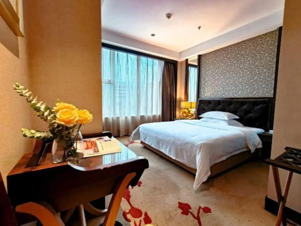 Bed in Dongguan Silver World Garden Hotel