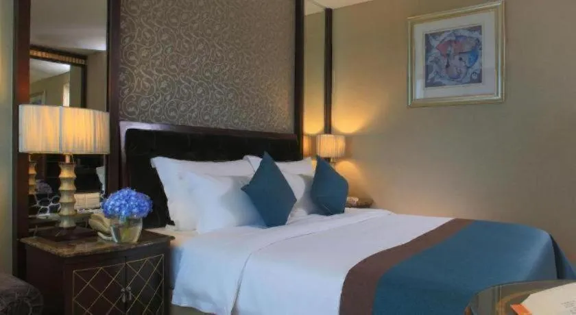 Bed in Dongguan Silver World Garden Hotel