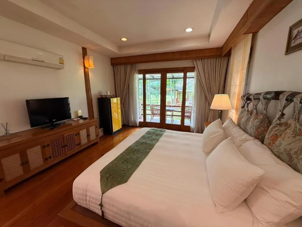 Bed in Chiangkham Luang Resort