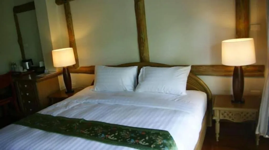Bed in Chiangkham Luang Resort