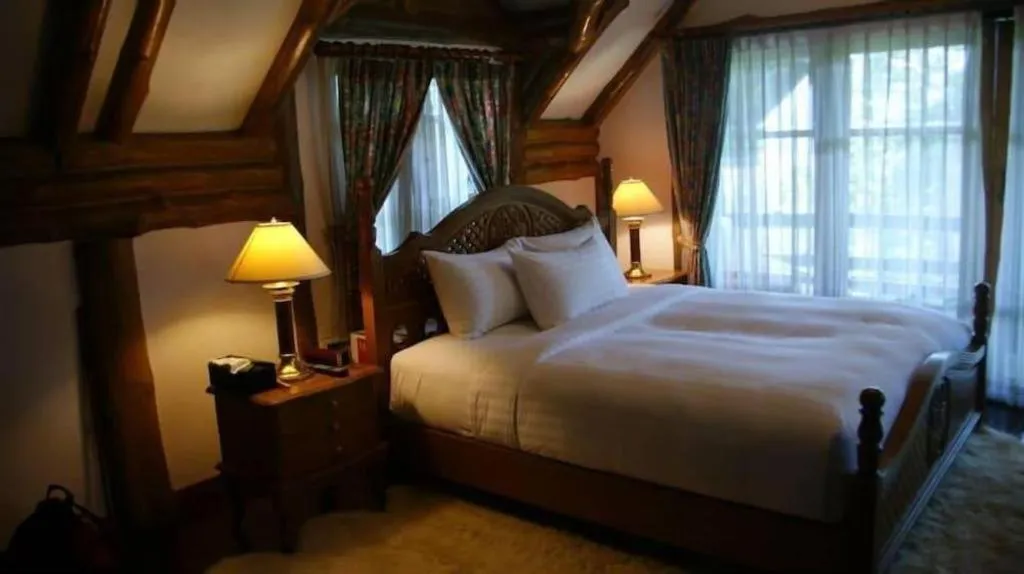 Bed in Chiangkham Luang Resort