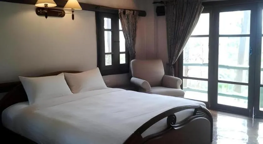 Bed in Chiangkham Luang Resort