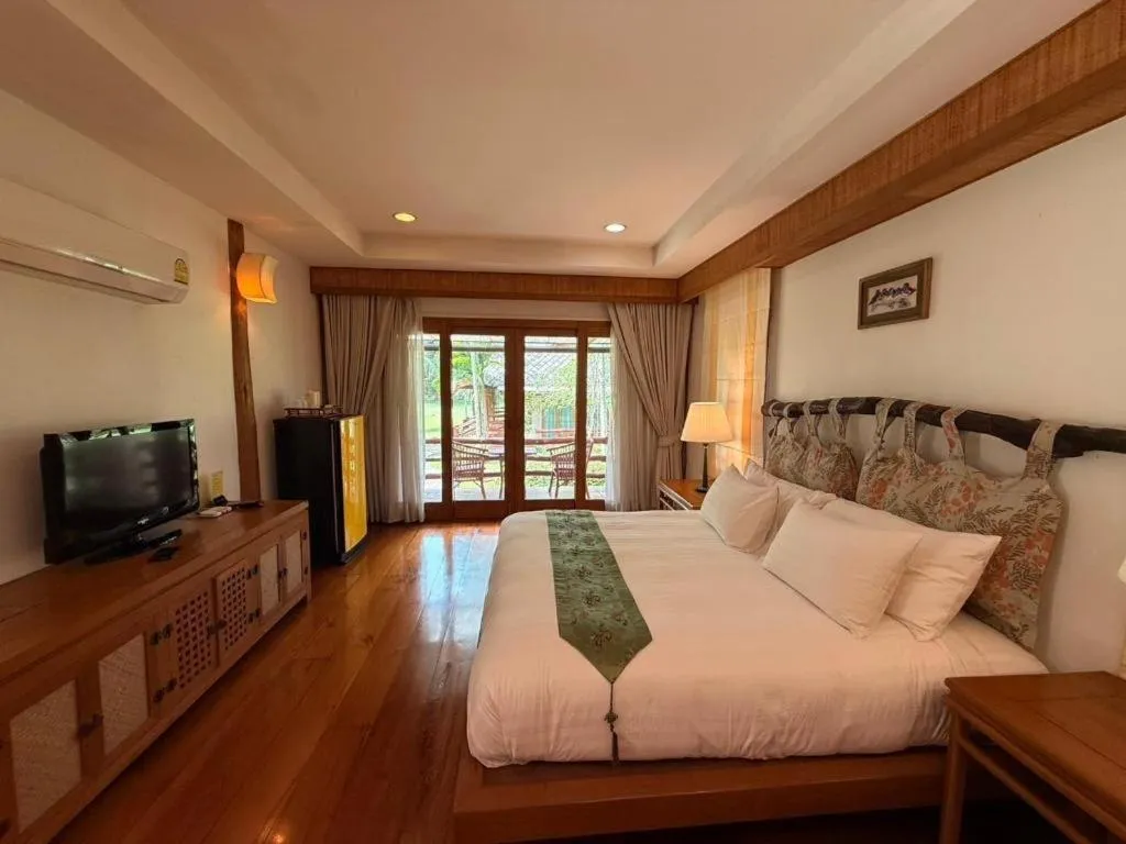 Bed in Chiangkham Luang Resort