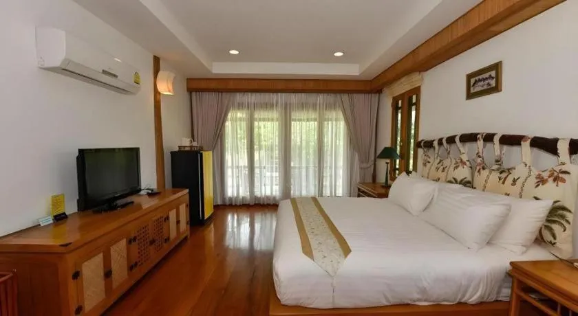 Bed in Chiangkham Luang Resort