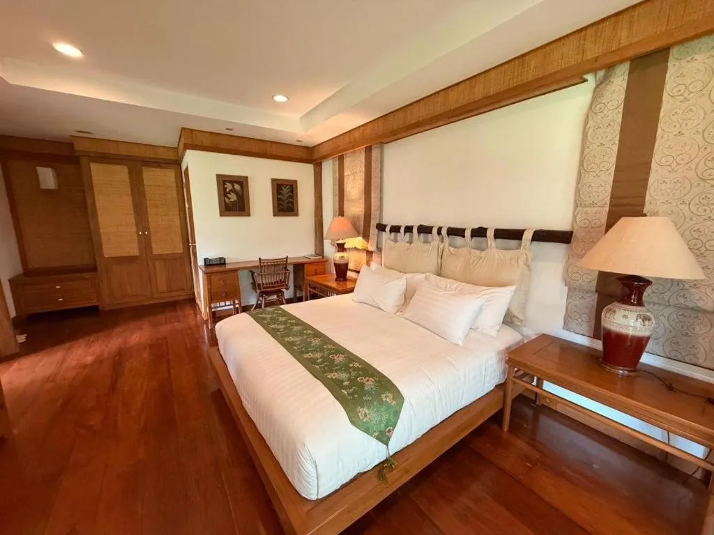Bed in Chiangkham Luang Resort