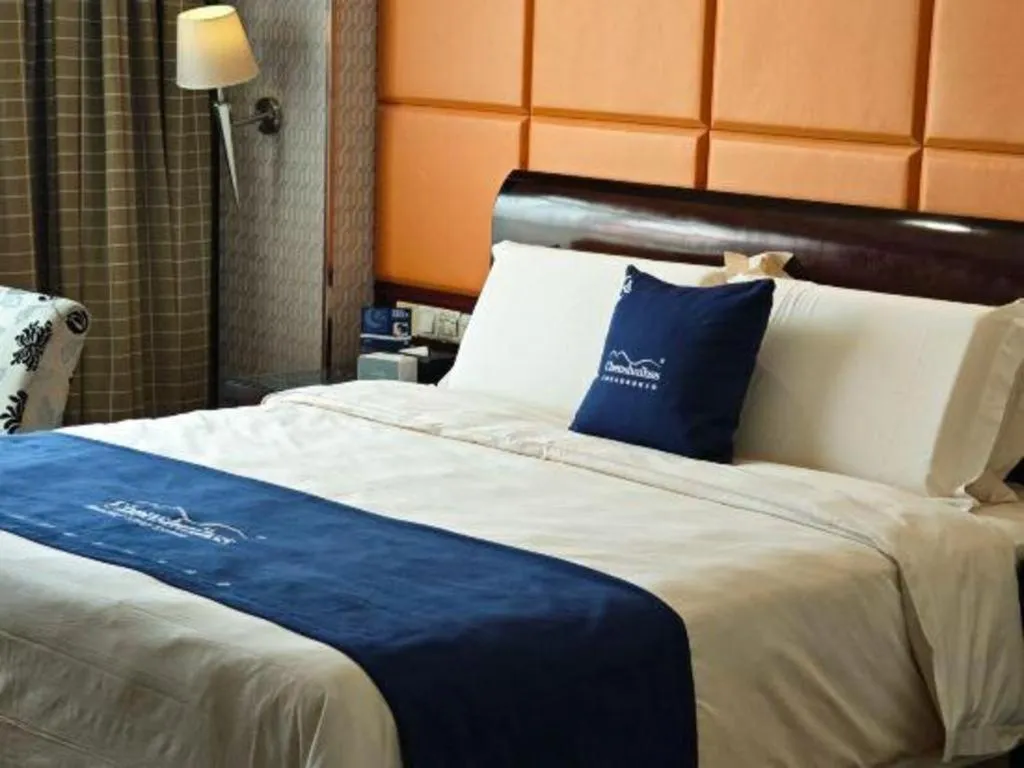 Bed in Chinflux Mandarin Hotel