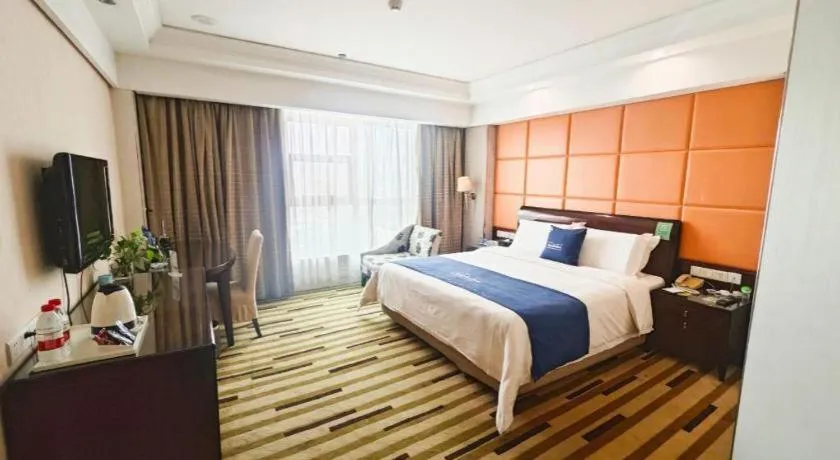 Bed in Chinflux Mandarin Hotel