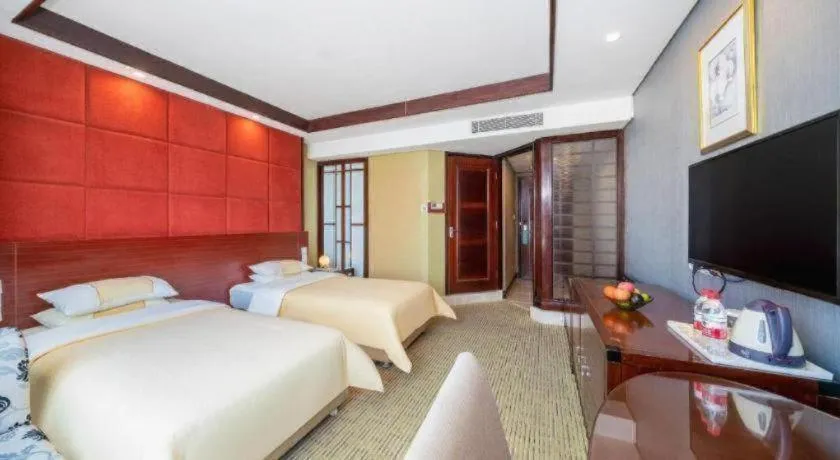 Bed in Chinflux Mandarin Hotel